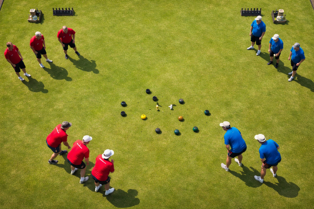 Two teams playing crown green bowling